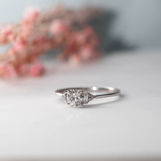 The Abi Ring | Round Moissanite & Diamond Baguette Accented Engagement