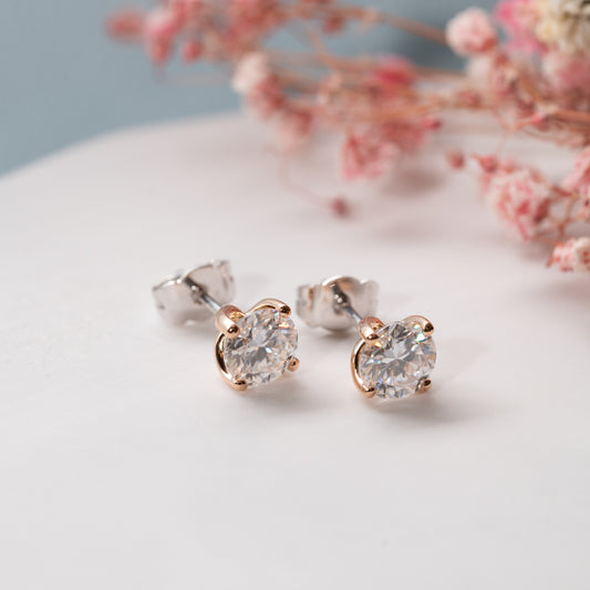 The Aria Earrings | Round Moissanite Twist Four Claw Solitaire Studs