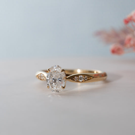 The Celia Ring | Moissanite & Diamond Oval Four Prong Accented Engagement Solitaire