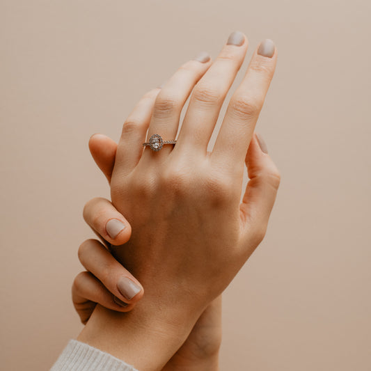 The Hila Ring | Moissanite & Diamond Oval Shoulder Set Engagement Halo
