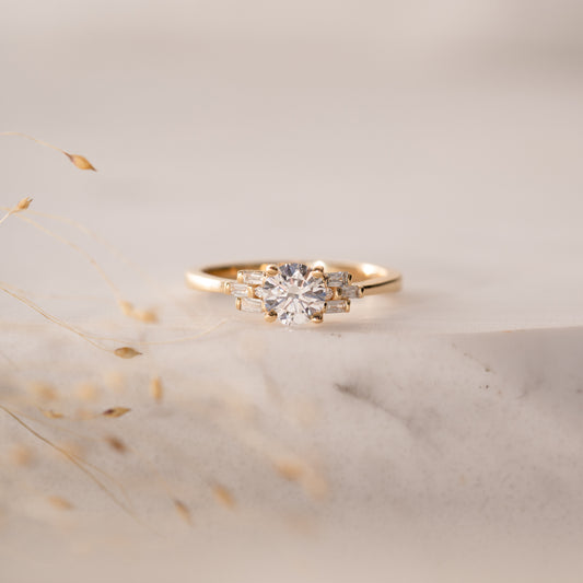 The Tanya Ring | Round Moissanite & Diamond Baguette Accented Art Deco Engagement