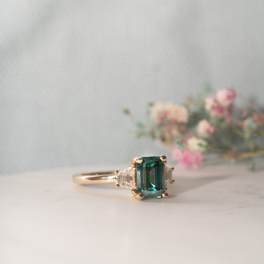 The Evelyn Ring | Emerald Cut Green Moissanite & Lab Diamond Trilogy
