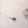 The Ninette Pendant | Round Blue Moissanite & Lab Diamond Halo