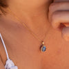 The Ninette Pendant | Round Blue Moissanite & Lab Diamond Halo