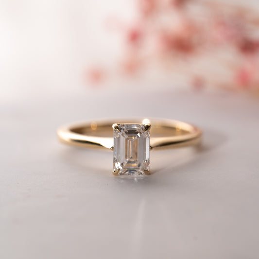 The Olivia Ring | Moissanite Emerald Cut Tapered Engagement Solitaire