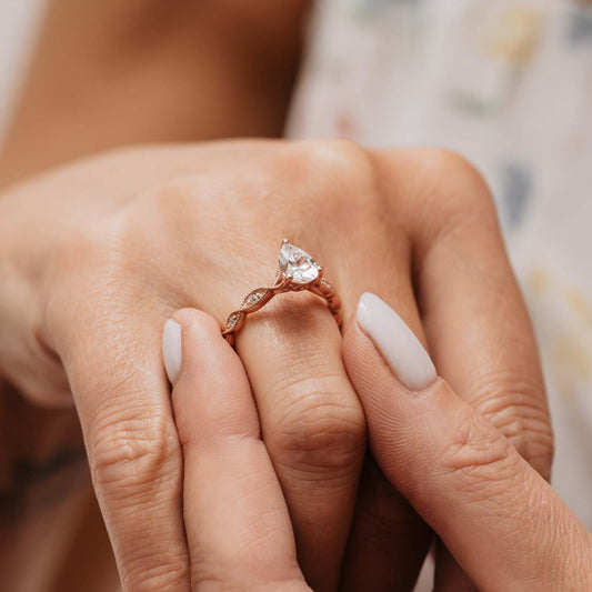 The Marcia Ring | Moissanite & Diamond Pear Cut Shoulder Set Engagement