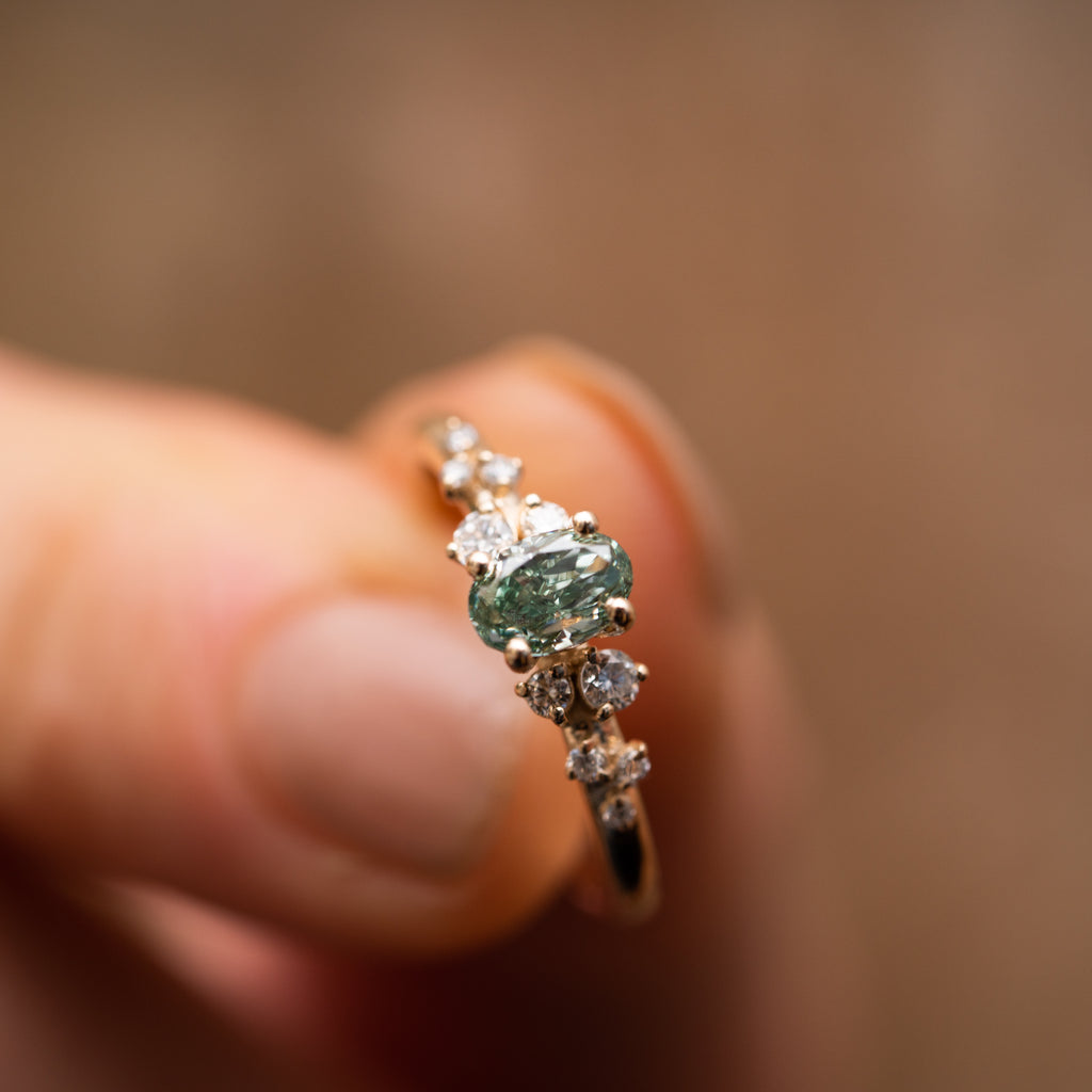 The Serephina Ring | 0.75ct Green Oval Lab Diamond Scattered Accented Engagement